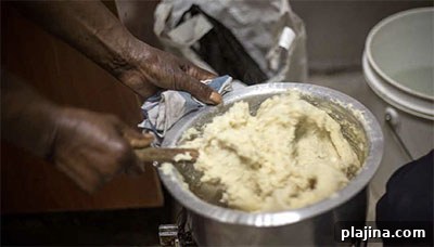 Woman preparing ugali