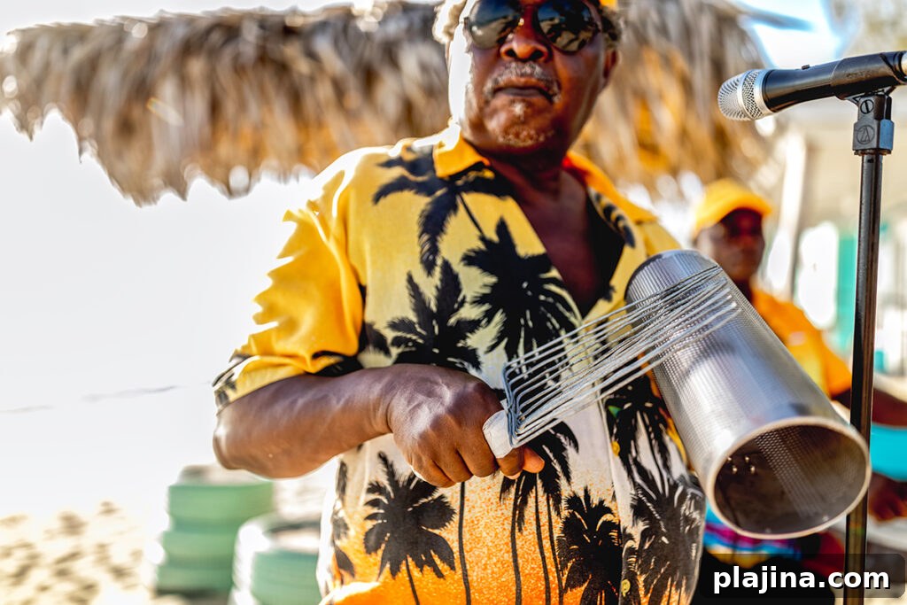 A man playing a rake and scraper instrument for Junkanoo