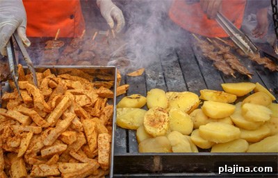 Preparing seasoned beef heart anticuchos in Lima
