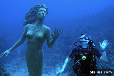 Mermaid statue and diver