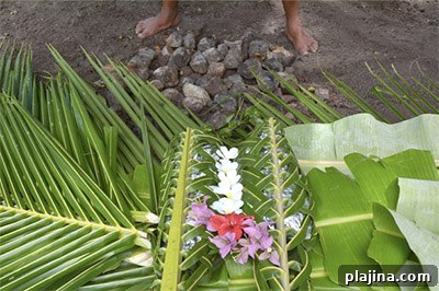 Fijian cooking food underground at a lovo 