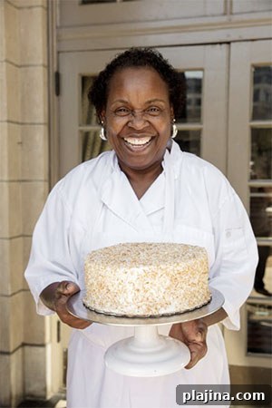 Dolester Miles holding her famous coconut pecan cake