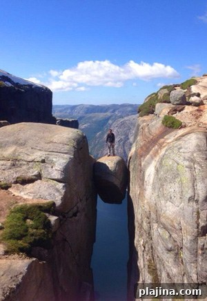 World traveler Dustin Reason, 35, of Connecticut, enjoys the view from Kjerag mountain in Norway, a heart-thumping 3,642 feet high.