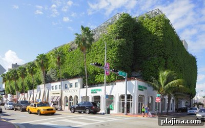 Eco-friendly parking garage and retail shops on Collins Avenue