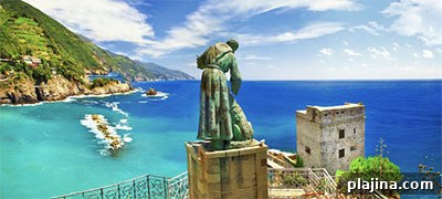 Monterosso al Mare, Cinque Terre, view of the bay with bronze sculpture of a monk